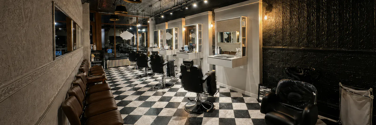 Inside Dino's Barbershop showing the checkerboard floor, barber chairs and renovated stations